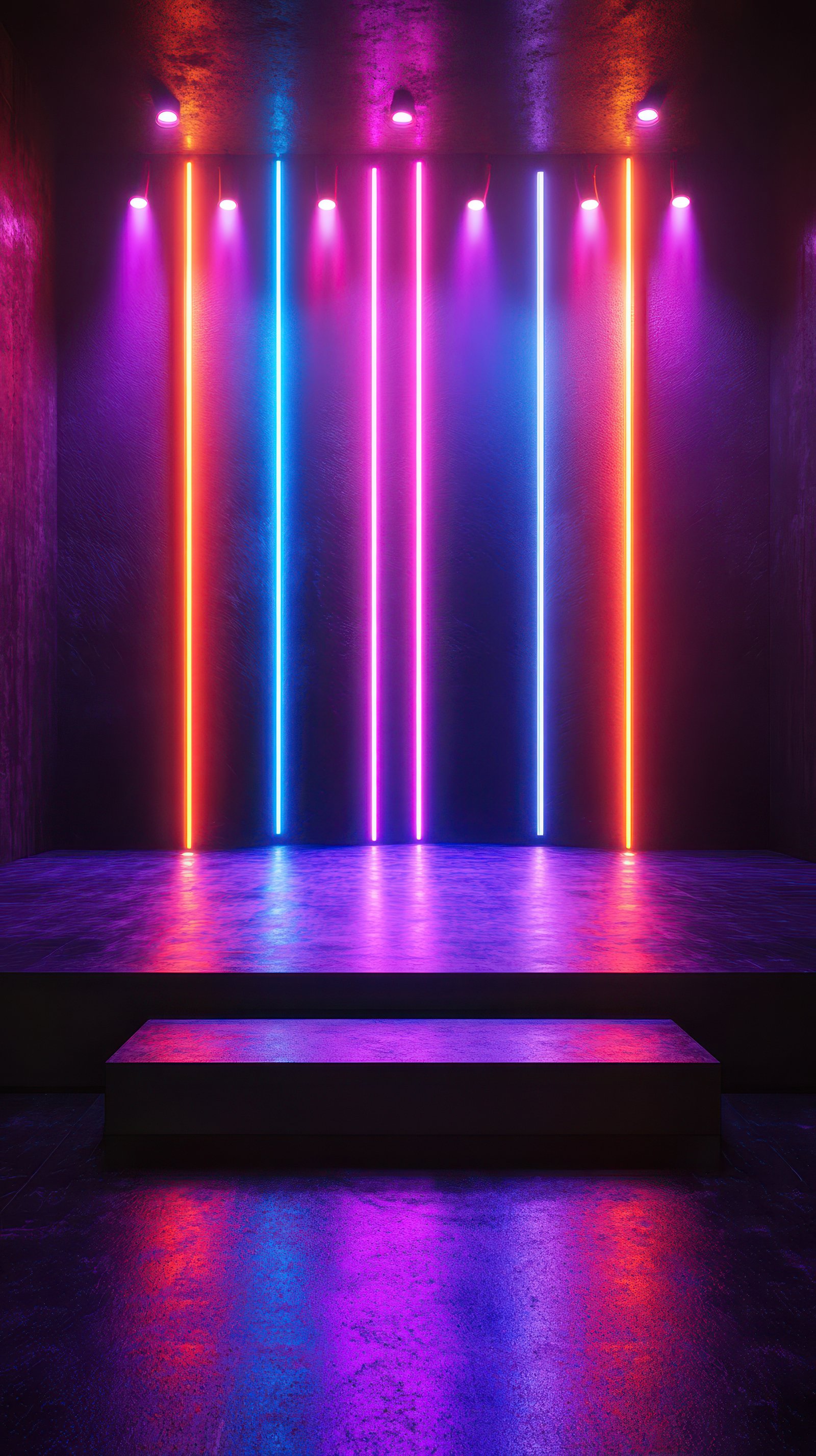 Colorful neon lights illuminate an empty stage creating a vibrant atmosphere in a modern venue
